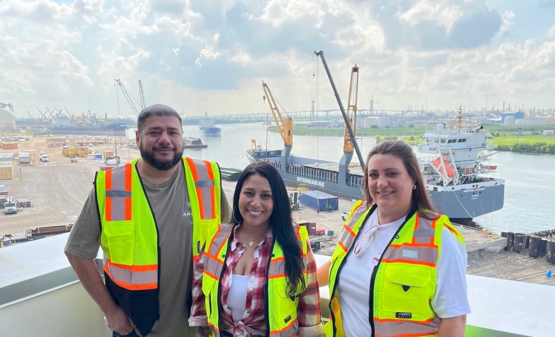 Picture of the Logistics Department at Watco Terminal with an Intermarine ship in the background.
