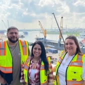 Picture of the Logistics Department at Watco Terminal with an Intermarine ship in the background.
